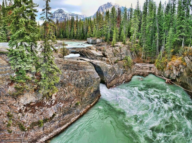 River Flowing Through Canyon — Green, Dramatic, Afternoon, Photograph, Trees, Mountains