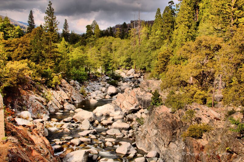 River Flowing Through Canyon — Green, Dramatic, Afternoon, Photograph, Trees, Rocks