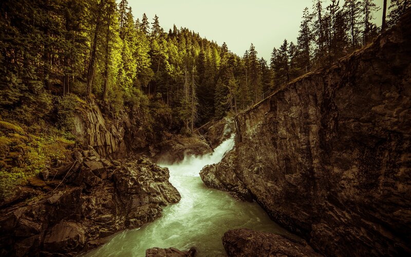 River Flowing Through Canyon — Green, Dramatic, Afternoon, Photograph, Trees, Rocks, Waterfall