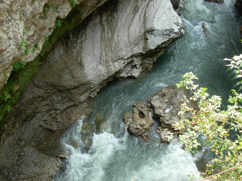 River Flowing Through Canyon — Green, Natural, Afternoon, Photograph, Rocks