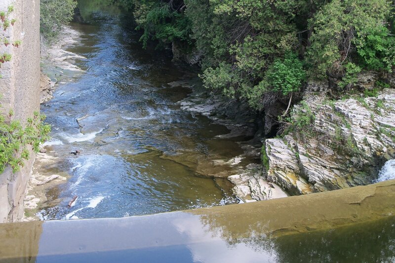 River Flowing Through Canyon — Green, Serene, Afternoon, Photograph, Trees, Rocks, Waterfall