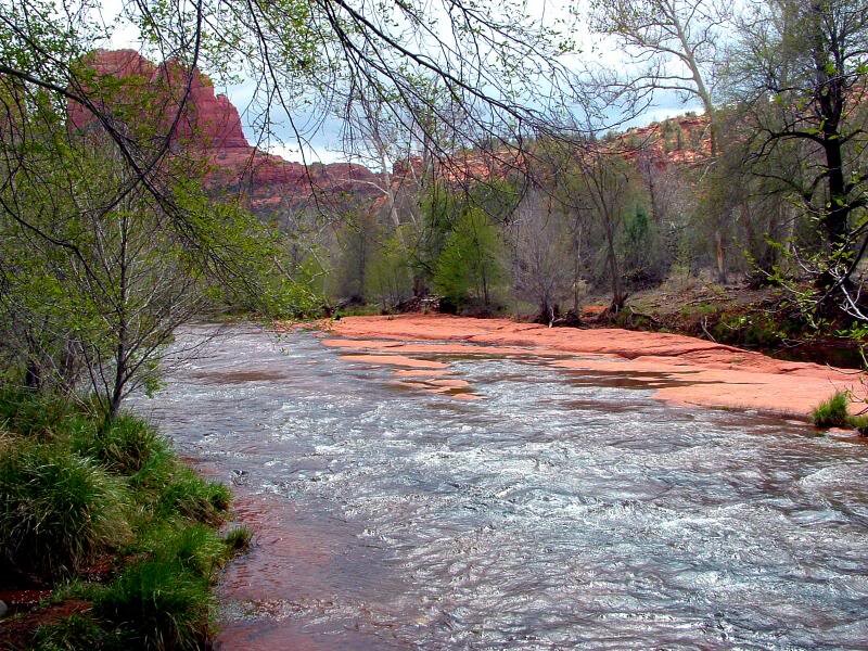 River Flowing Through Canyon — Red, Serene