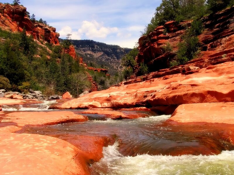 River Flowing Through Canyon — Red