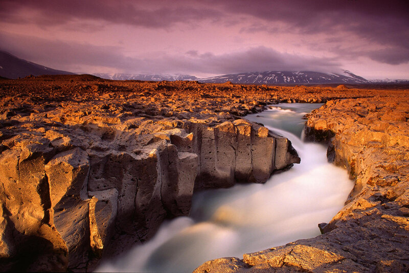 River Flowing Through Canyon — Sunset