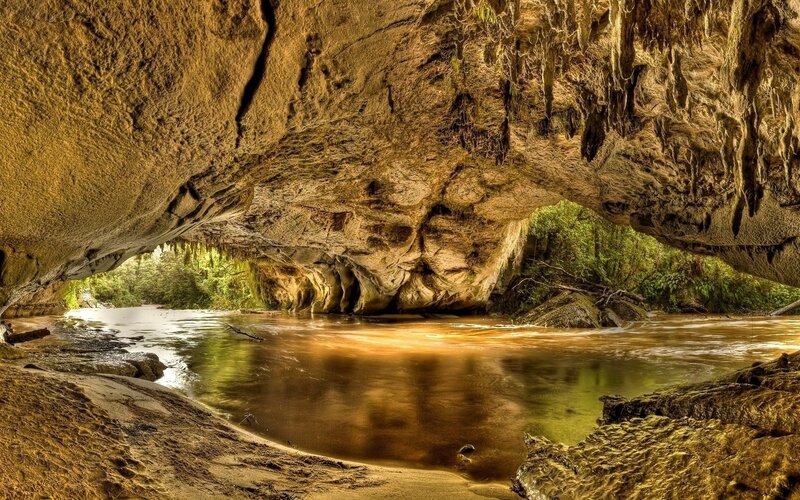River Flowing Through Cave — Afternoon