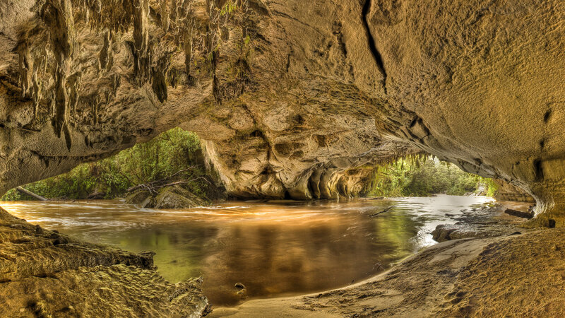 River Flowing Through Cave — Brown, Serene, Afternoon, Photograph