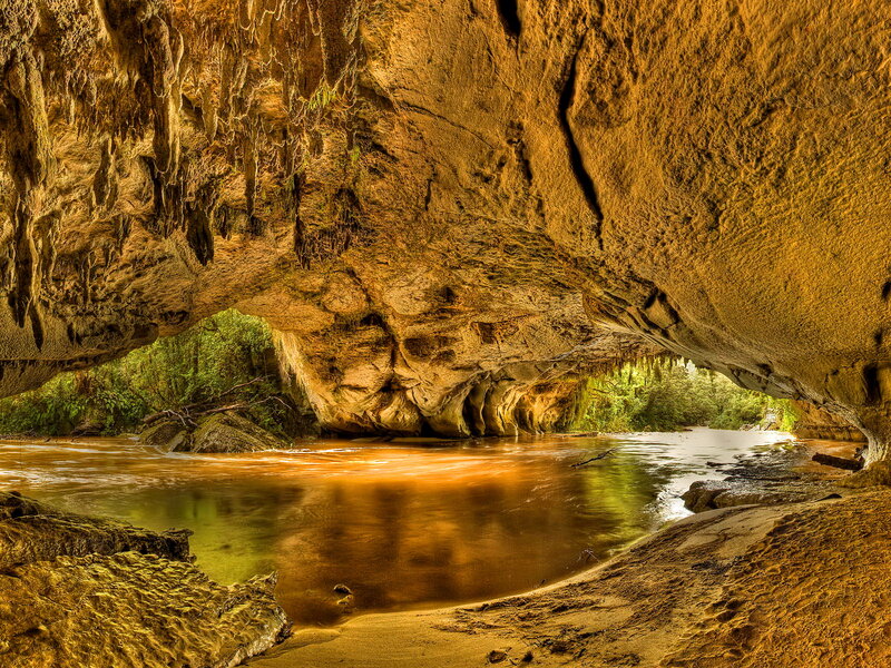 River Flowing Through Cave — Brown, Serene, Afternoon
