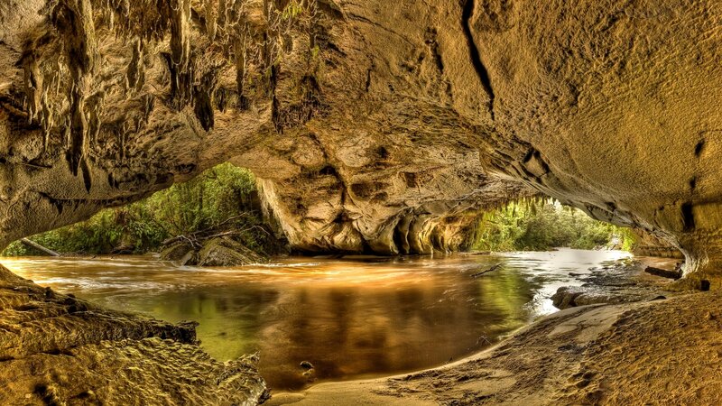 River Flowing Through Cave — Brown