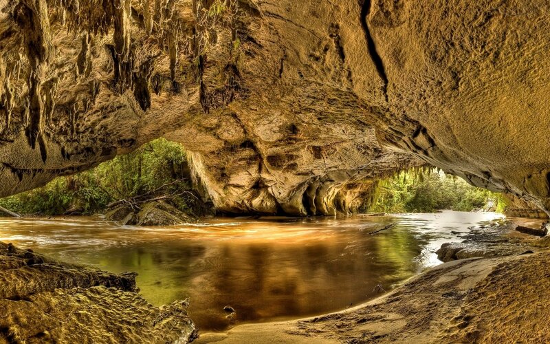 River Flowing Through Cave — Serene