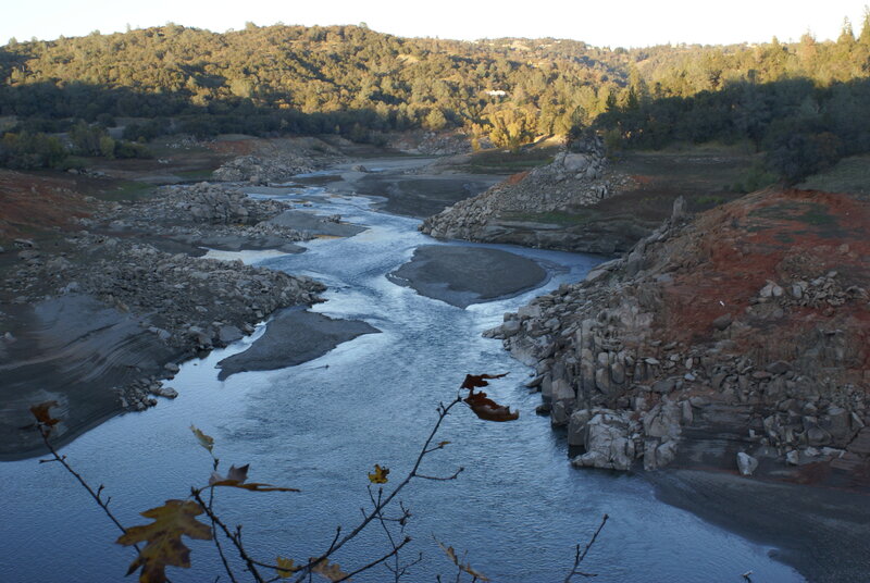 river flowing through dry landscape