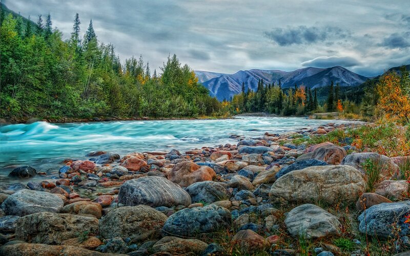 River Flowing Through Forest — Blue, Dramatic, Autumn, Photograph