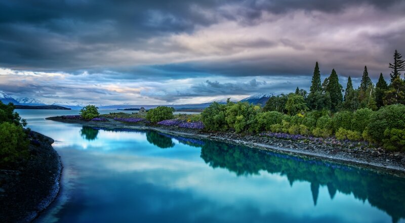 River Flowing Through Forest — Blue, Dramatic, Sunset, Photograph