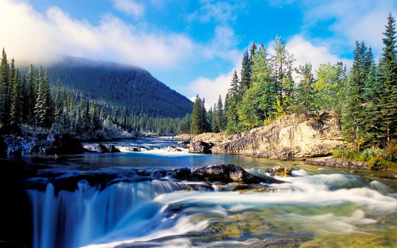 River Flowing Through Forest — Blue, Serene, Afternoon, Photograph, Mountain