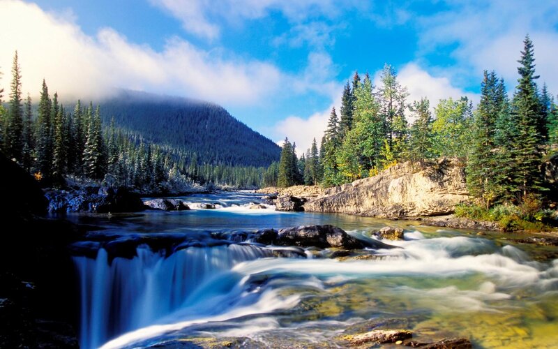 River Flowing Through Forest — Blue, Serene, Afternoon, Photograph, Mountain, Trees