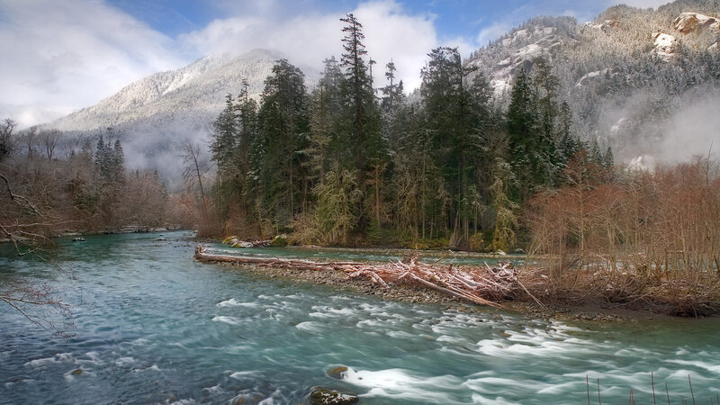 River Flowing Through Forest — Blue, Serene, Winter, Photograph, Mountains, Trees, Snow