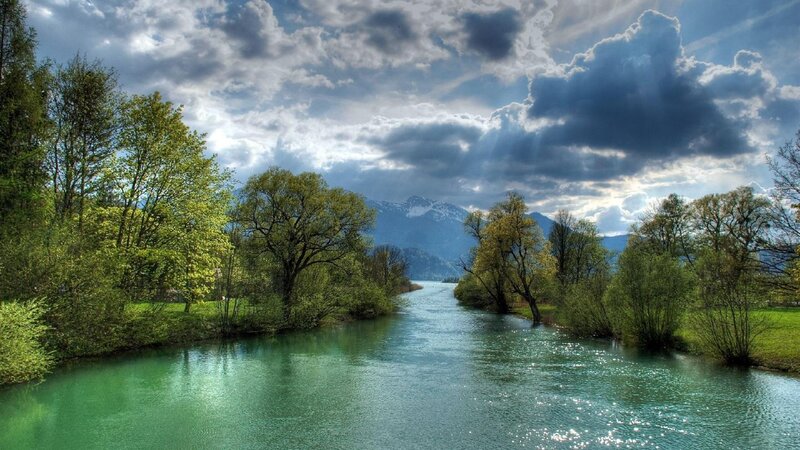 River Flowing Through Forest — Green, Dramatic, Afternoon, Photograph, Trees, Mountains