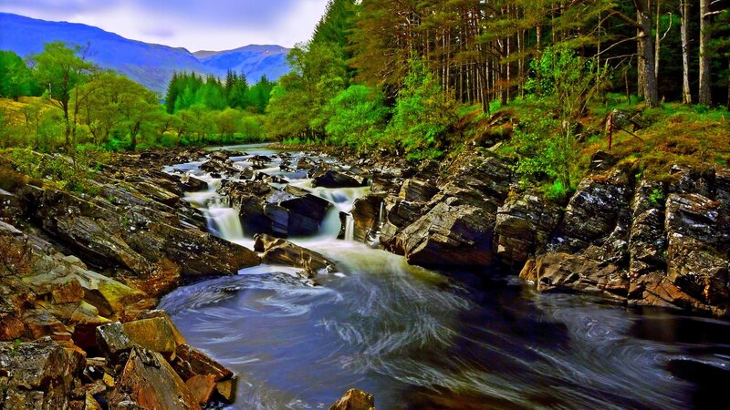 River Flowing Through Forest — Green, Serene, Afternoon, Photograph, Mountains, Trees, Rocks