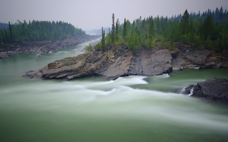 River Flowing Through Forest — Green, Serene, Photograph, Trees, Rocks, Rapids