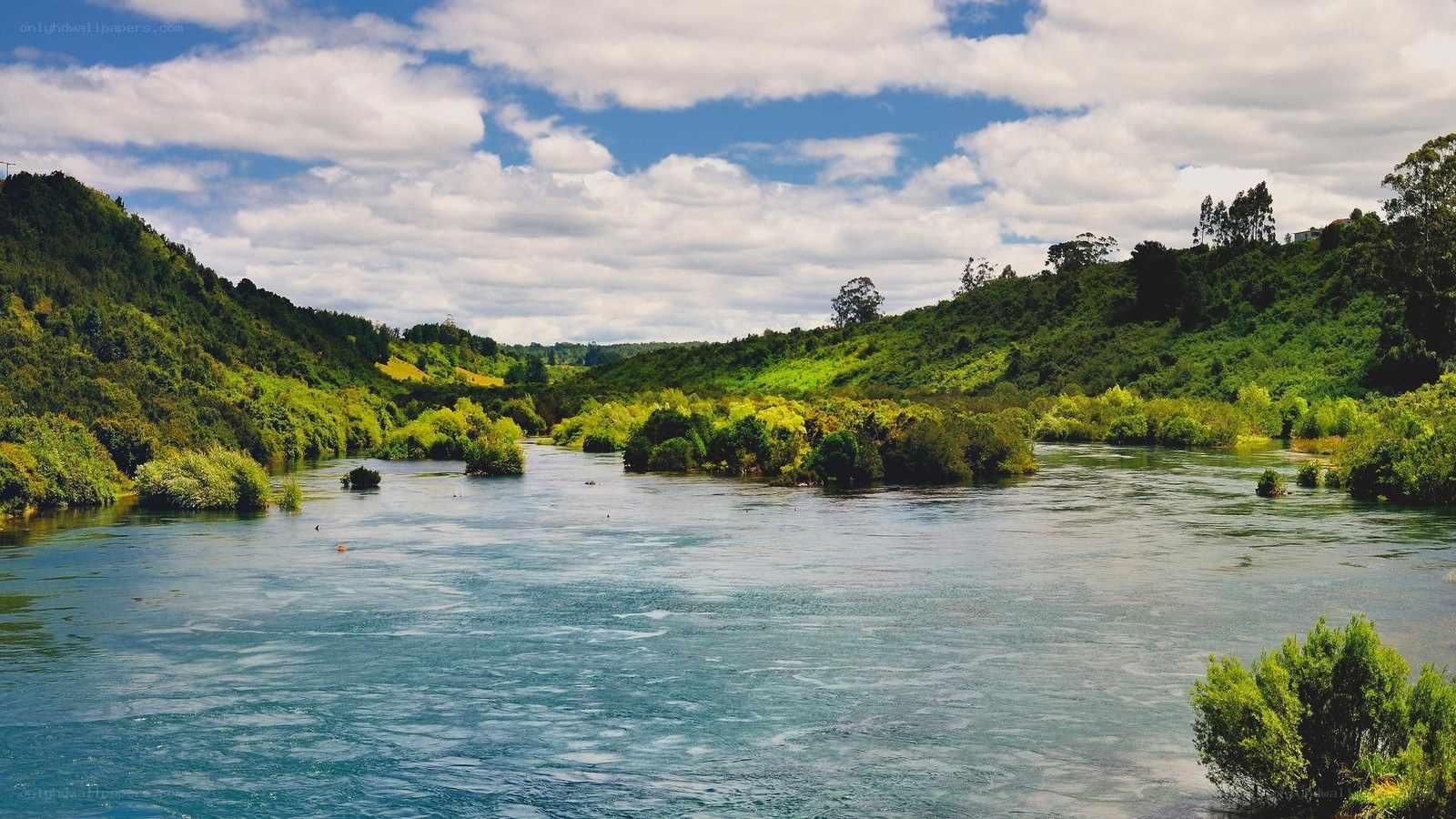 River flowing through green hills