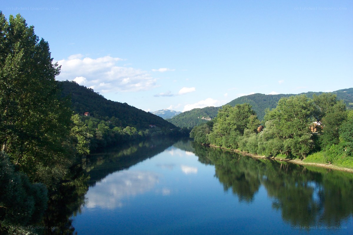 River flowing through green hills