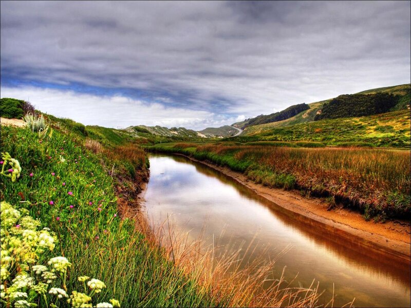 River flowing through green hills