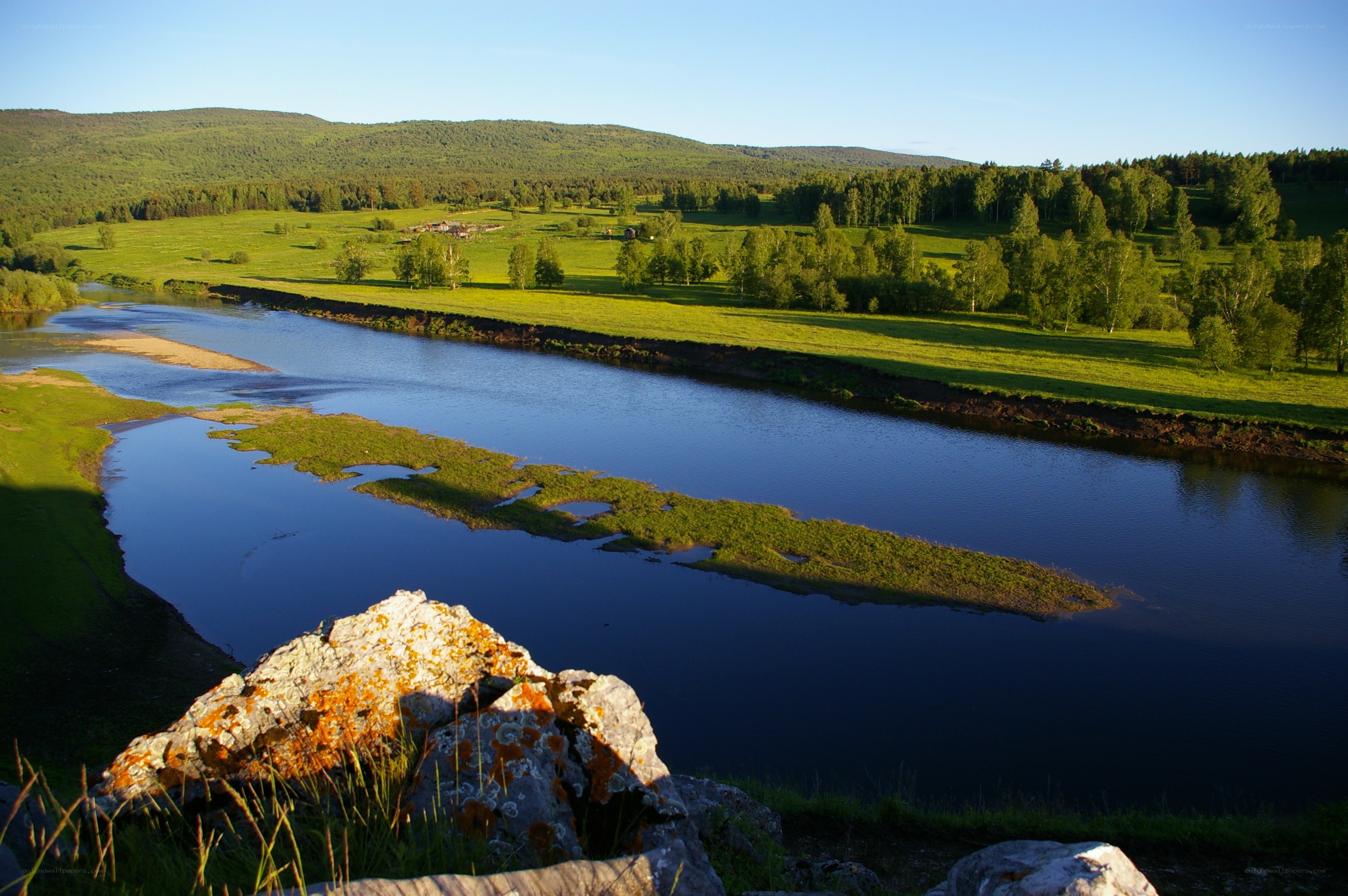 River flowing through green valley