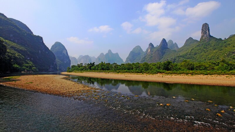River Flowing Through Karst Mountains — Green