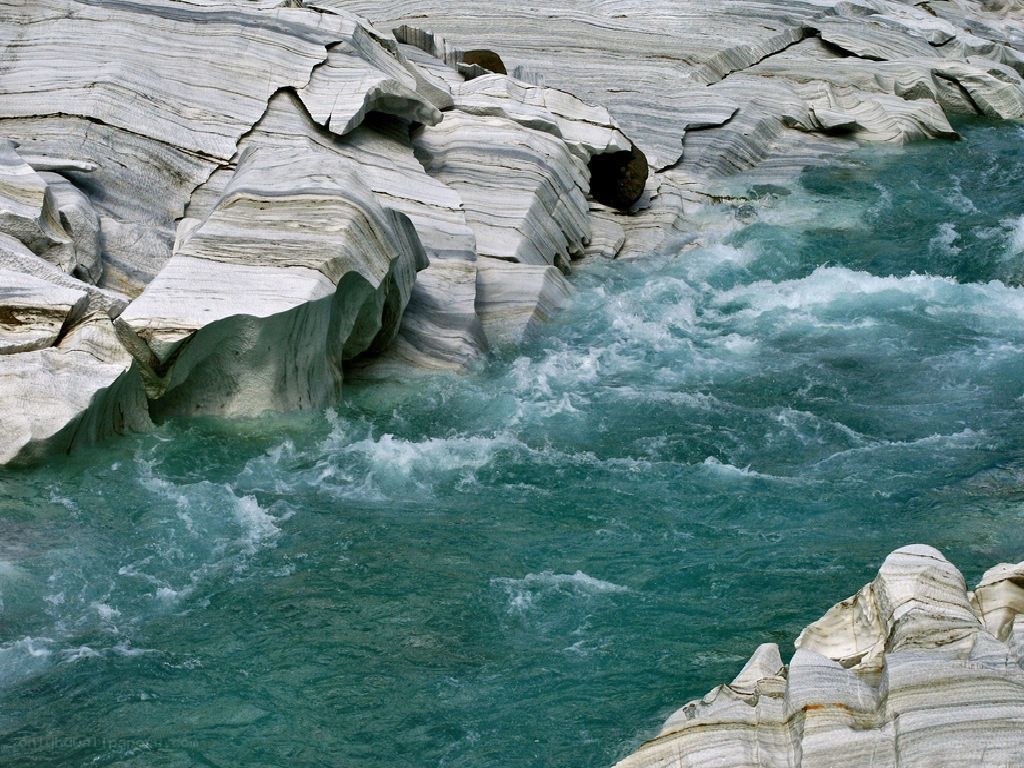 River flowing through layered rock
