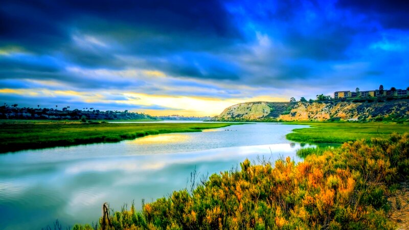 River Flowing Through Marsh — Blue, Dramatic, Sunset