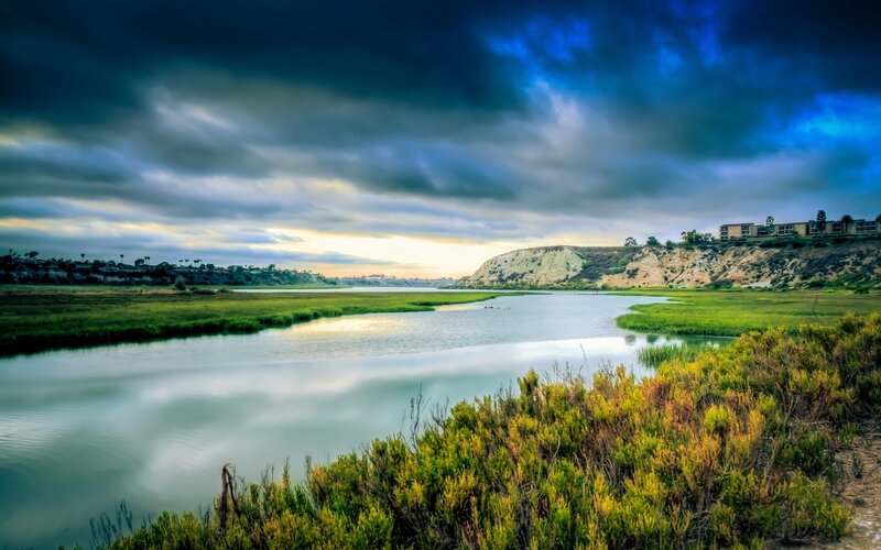 River Flowing Through Marsh — Blue, Dramatic