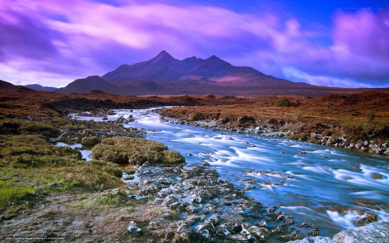 River flowing through mountain landscape