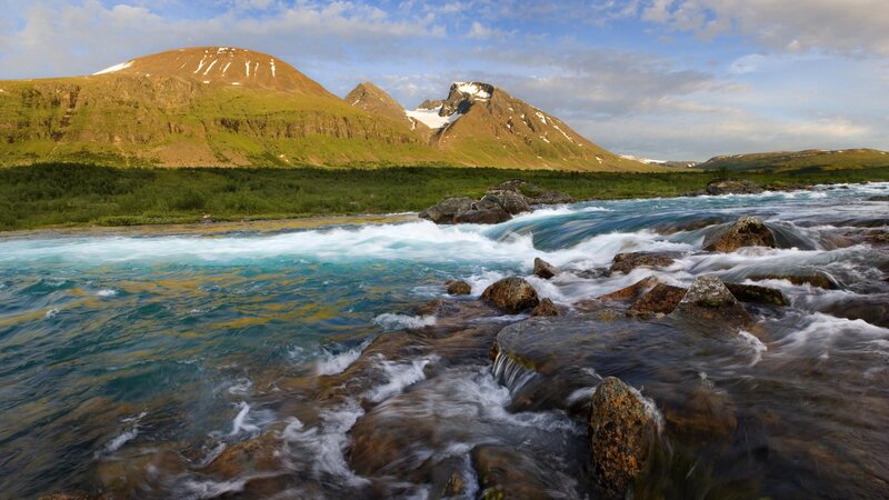 River flowing through mountain landscape
