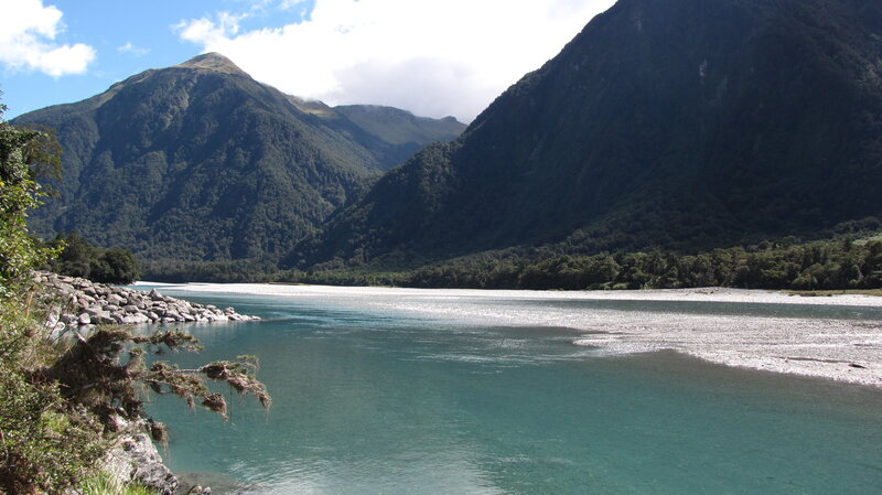 river flowing through mountain valley