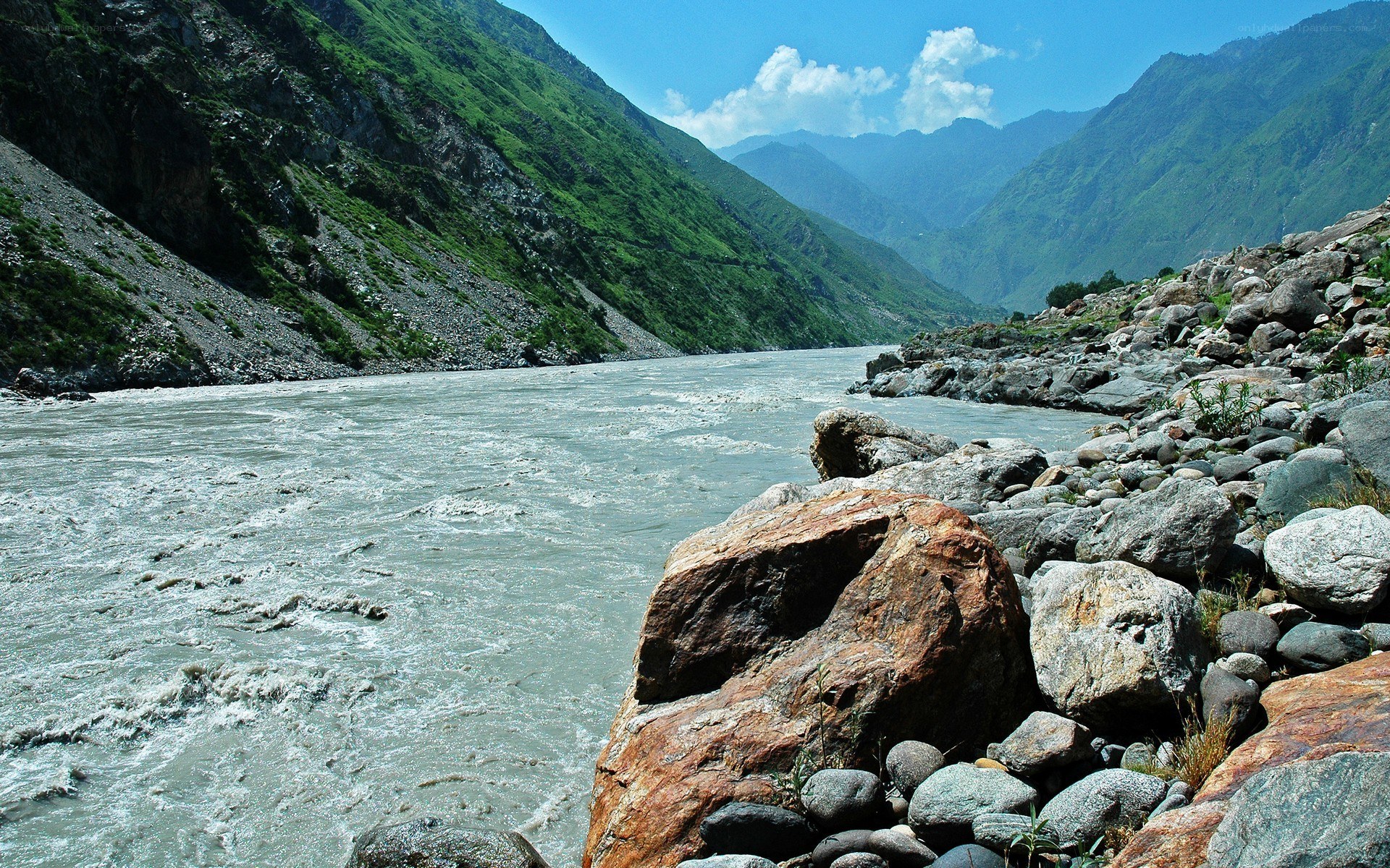 river flowing through mountain valley