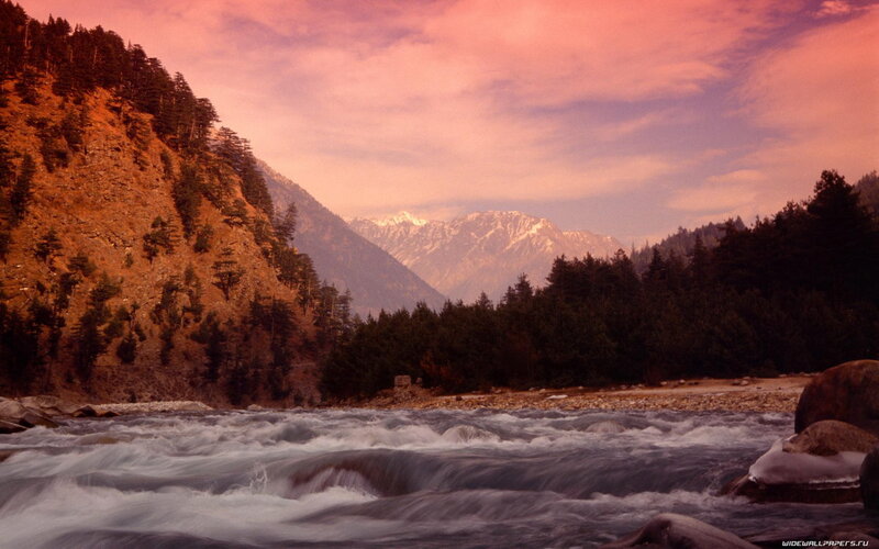 river flowing through mountain valley