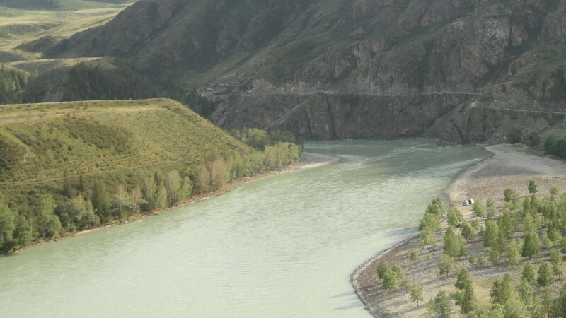 river flowing through mountain valley