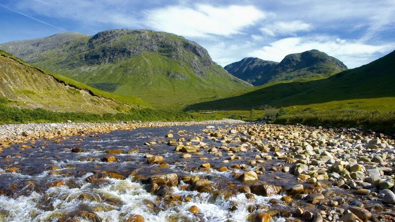 river flowing through mountain valley