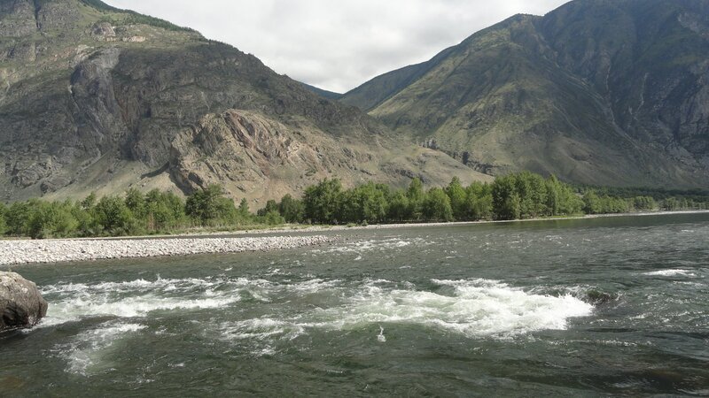 river flowing through mountain valley