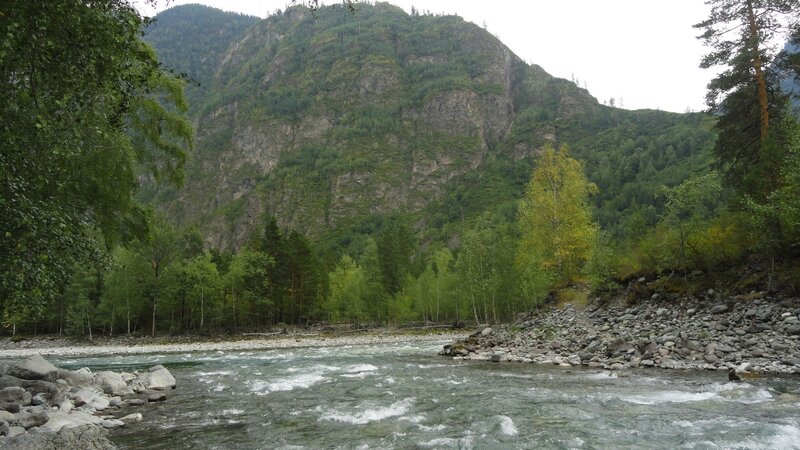 river flowing through mountain valley