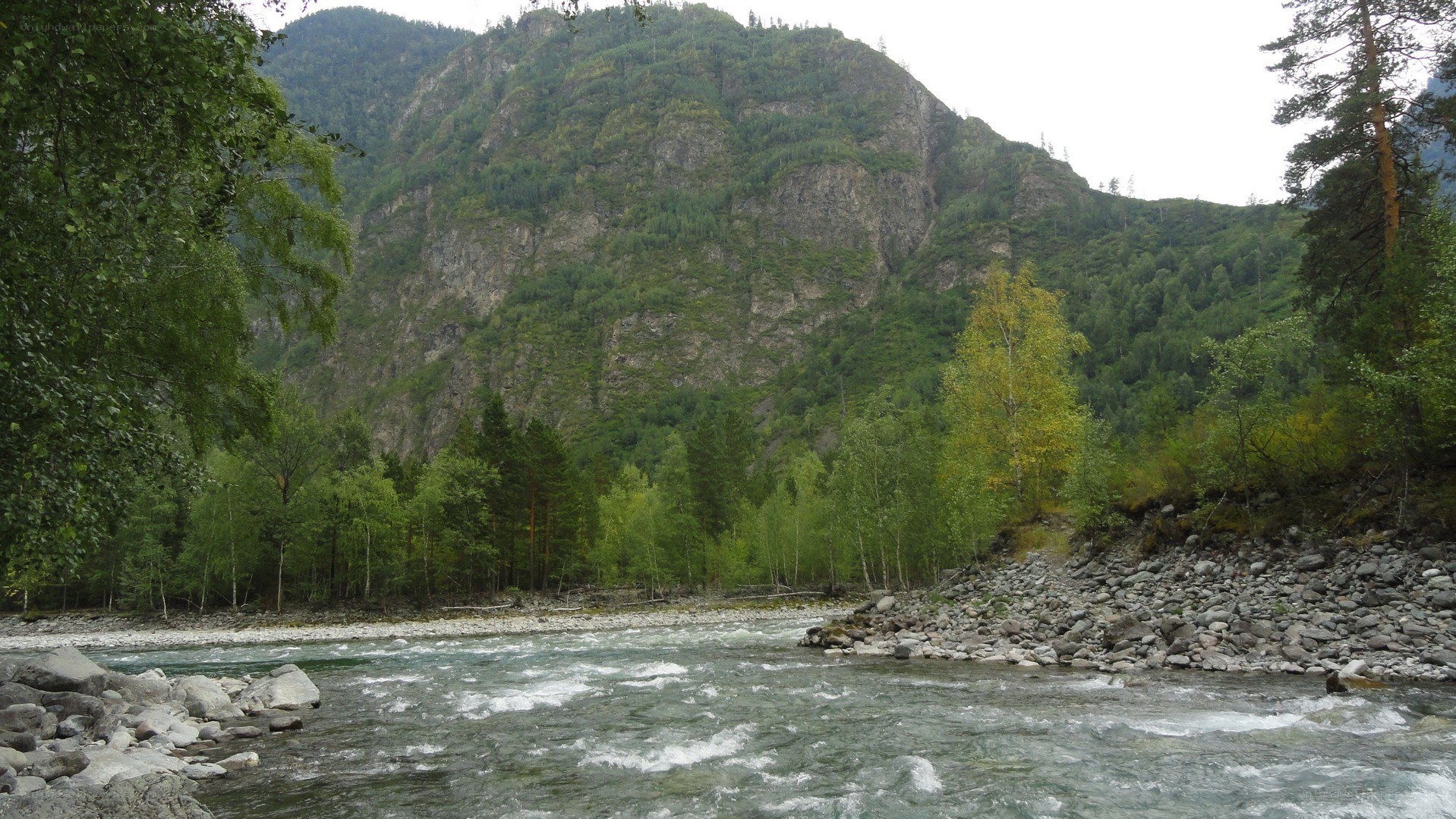 river flowing through mountain valley
