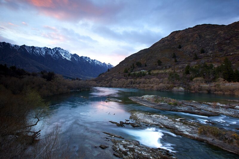 river flowing through mountain valley
