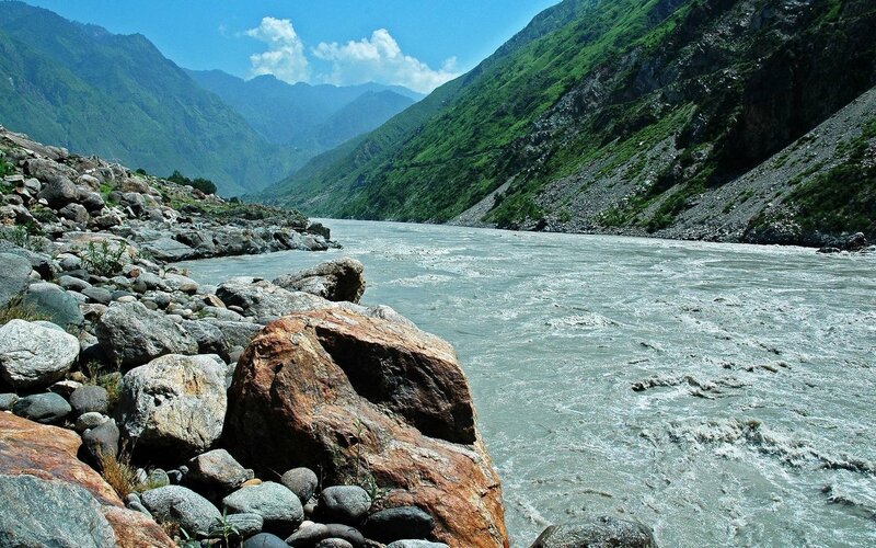 river flowing through mountain valley
