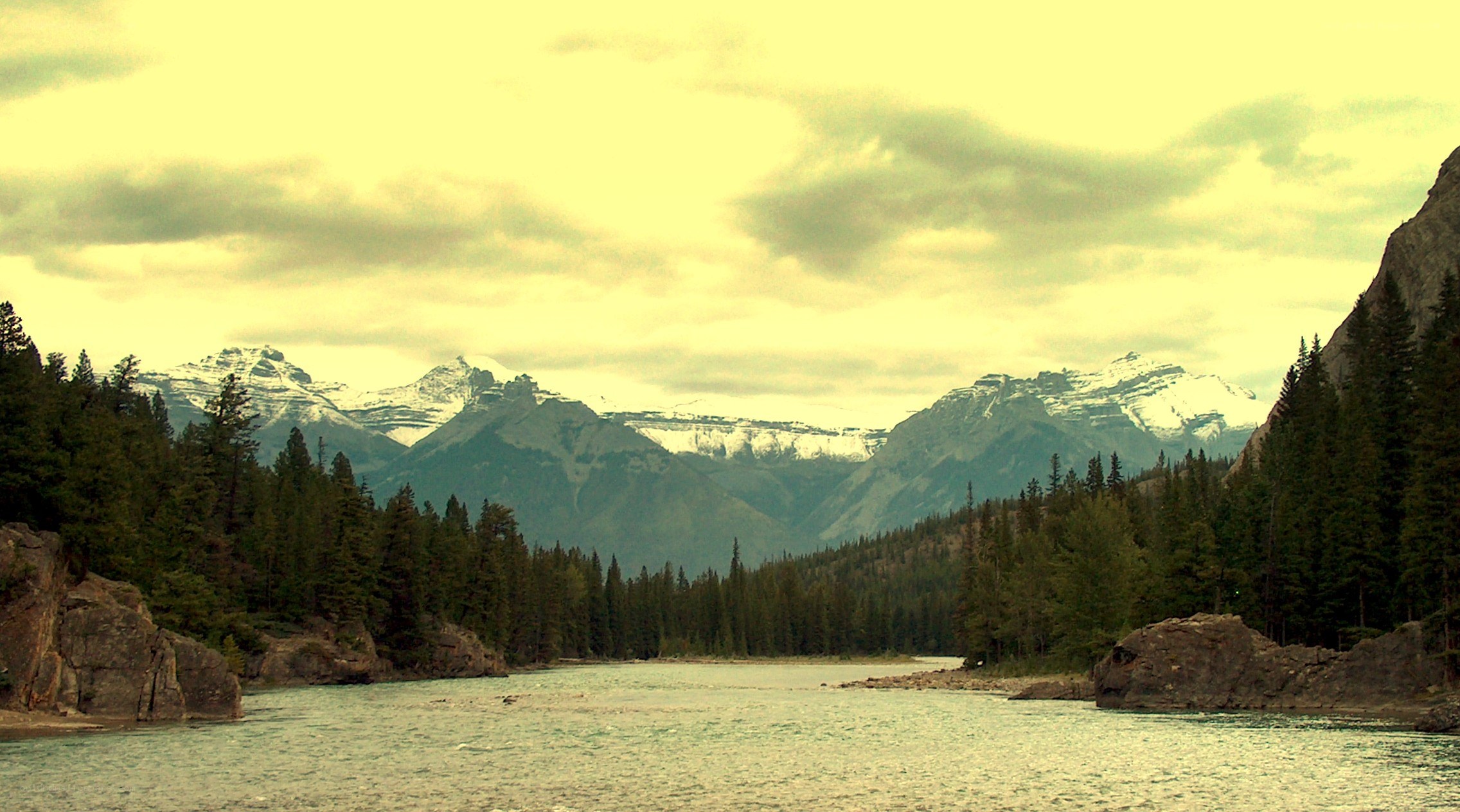 river flowing through mountain valley