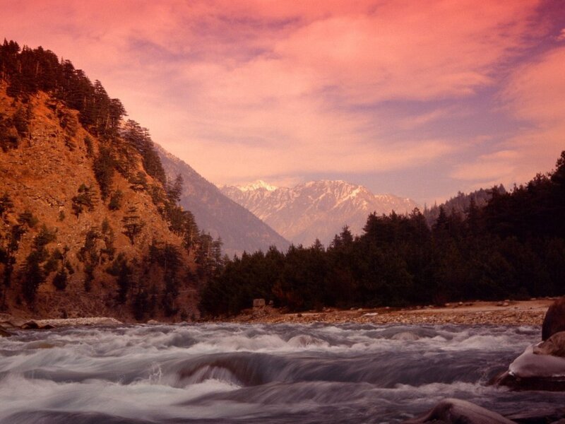 river flowing through mountain valley