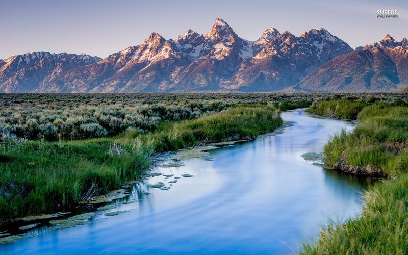 river flowing through mountains
