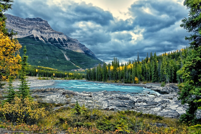 River Flowing Through Mountains — Blue, Dramatic, Autumn, Photograph, Mountain, Forest, Clouds