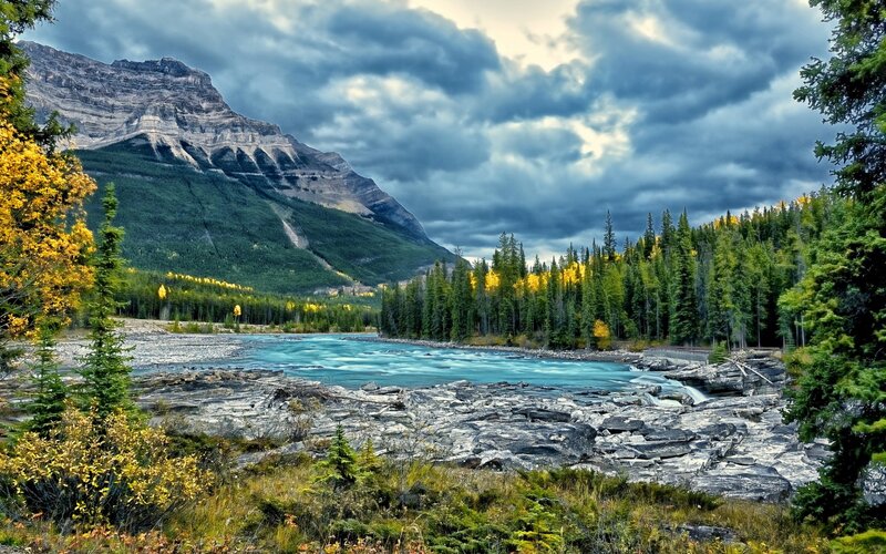 River Flowing Through Mountains — Blue, Dramatic, Autumn, Photograph, Mountain