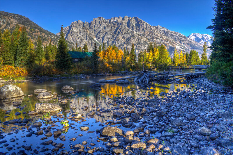 River Flowing Through Mountains — Blue, Serene, Autumn, Photograph
