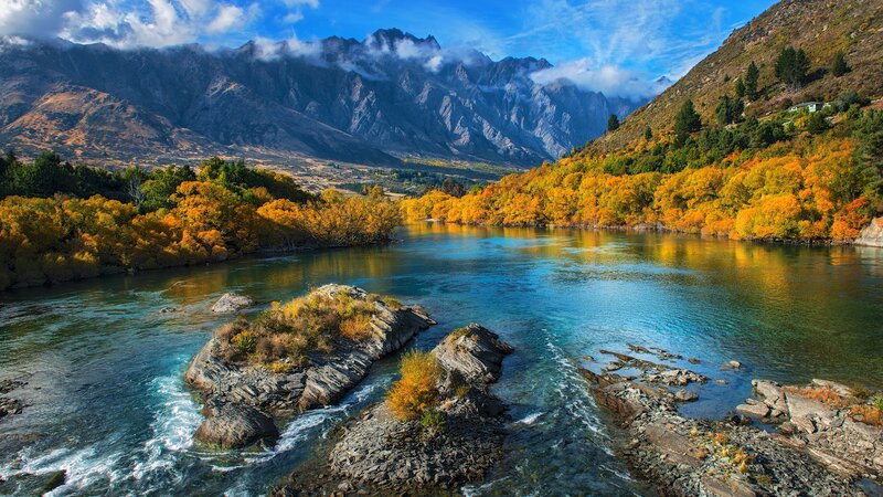 River Flowing Through Mountains — Blue, Serene, Autumn, Photograph, Trees