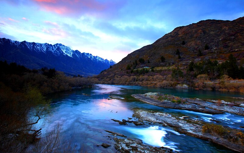 River Flowing Through Mountains — Blue, Serene, Sunset, Photograph